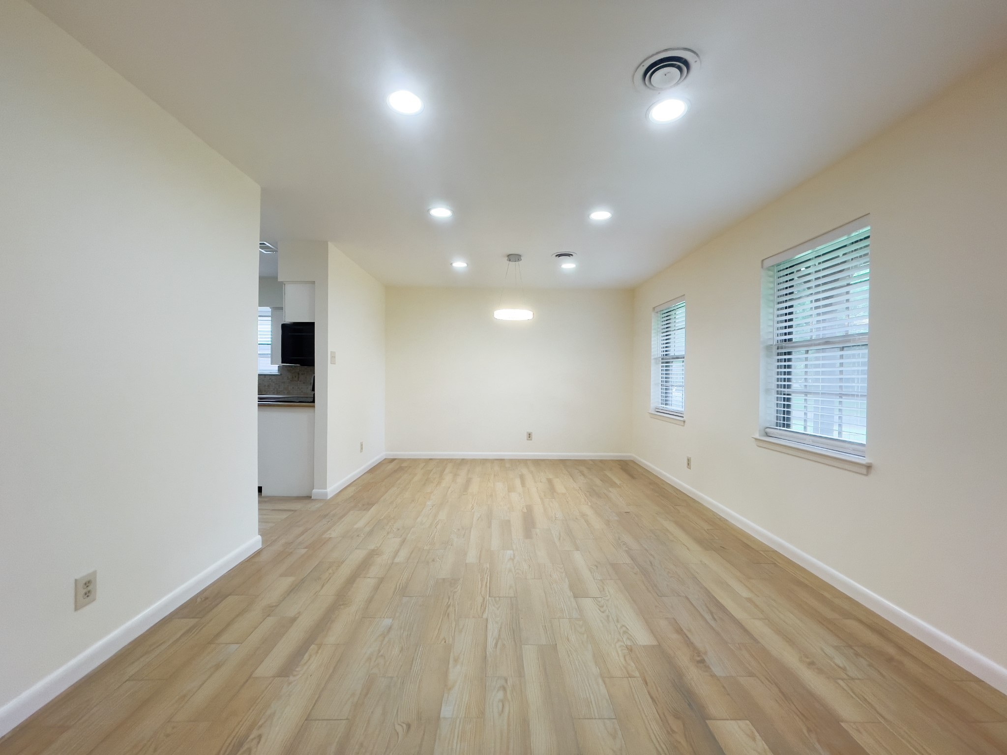 7710 Romney Road Houston, TX 77036 - Photo 7 of 31 an empty room with windows