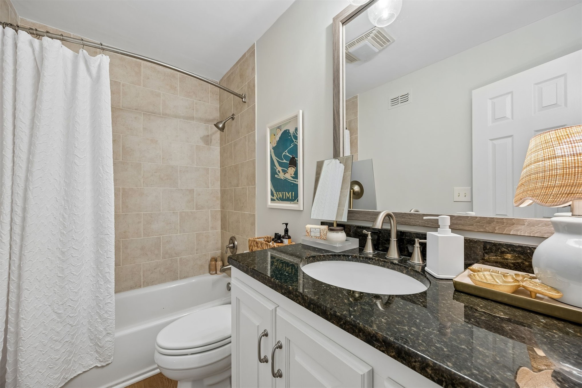 2005 Beachwood Road, Unit 2005 Amelia Island, FL 32034 - Photo 22 of 43 a bathroom with a granite countertop sink and a mirror