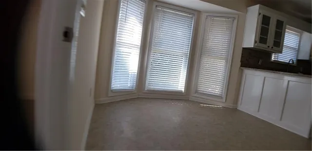 a view of a room that has a window in it