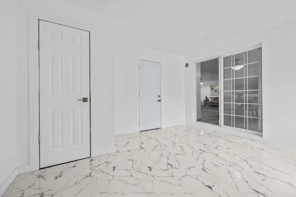 a view of empty room with windows