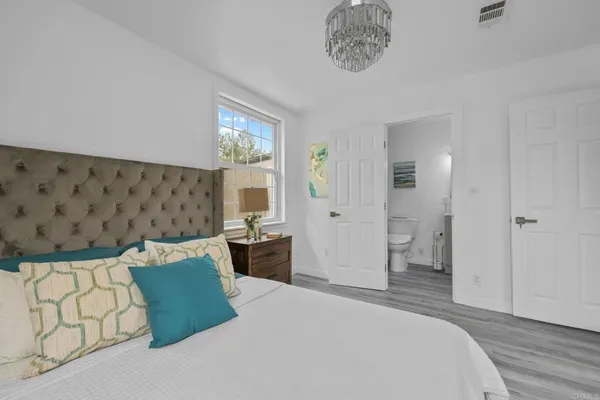 a bedroom with a bed and a couch