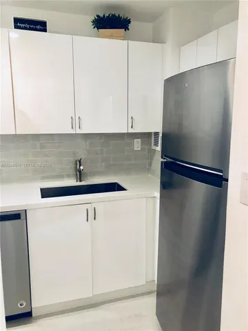 a kitchen with a stove and a microwave