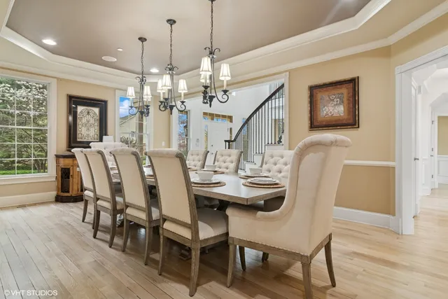 a living room with furniture and large windows