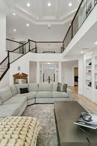 a bedroom with furniture and a large window