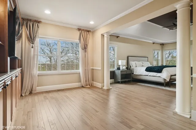 a large kitchen with a table and chairs
