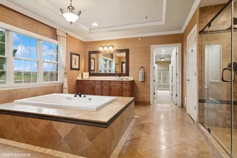 a large kitchen with a table and chairs