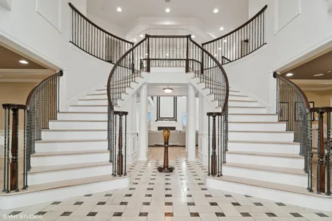 a kitchen with kitchen island granite countertop a sink a center island and cabinets
