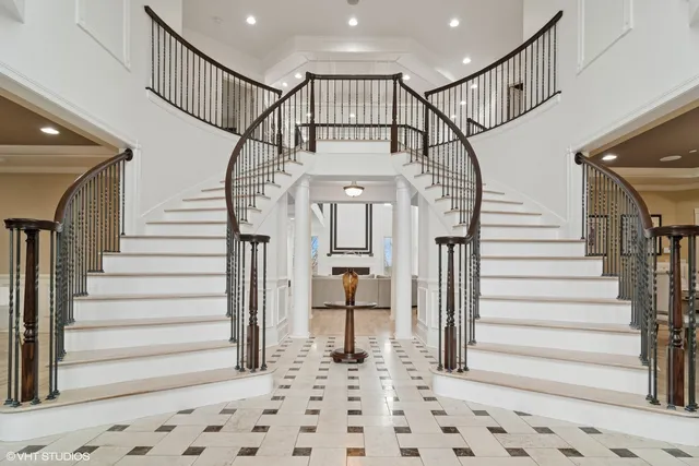 a kitchen with kitchen island granite countertop a sink a center island and cabinets
