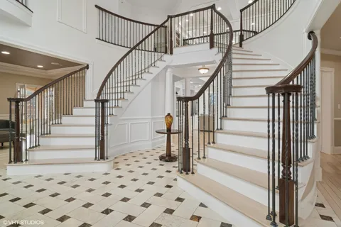 a kitchen with stainless steel appliances granite countertop a stove and white cabinets