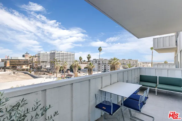 a view of roof deck with seating space and barbeque oven