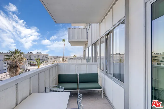 a view of balcony with furniture