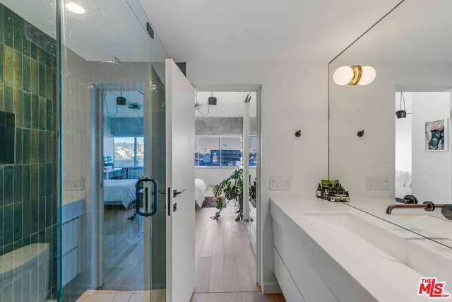 a very nice looking room with a large window and chandelier