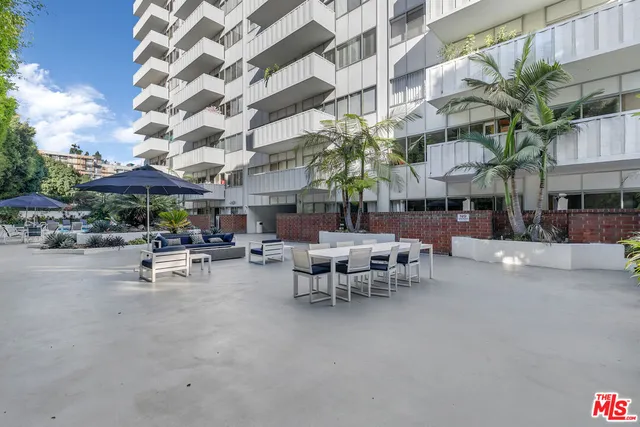 a view of a building with sitting area