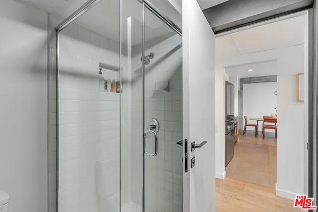 a view of a room with a glass door and closet