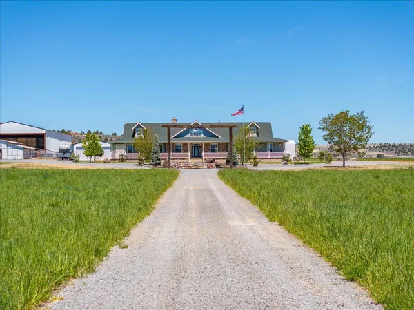 a view of a dining room with furniture and a window