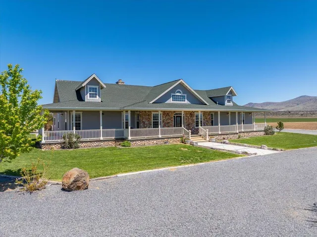 a view of a dining room with furniture and a potted plant
