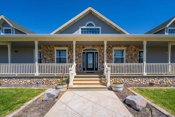 a view of a livingroom with furniture and a window