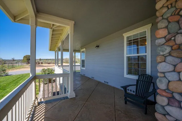 a spacious bedroom with a bed and a window