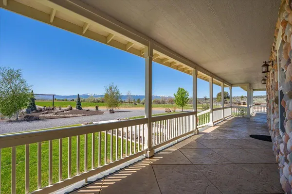 a bathroom with a granite countertop sink and a bathtub