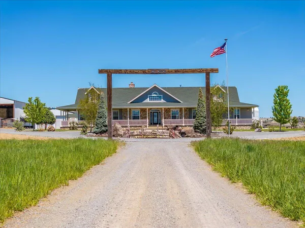 an aerial view of a house with a lake view
