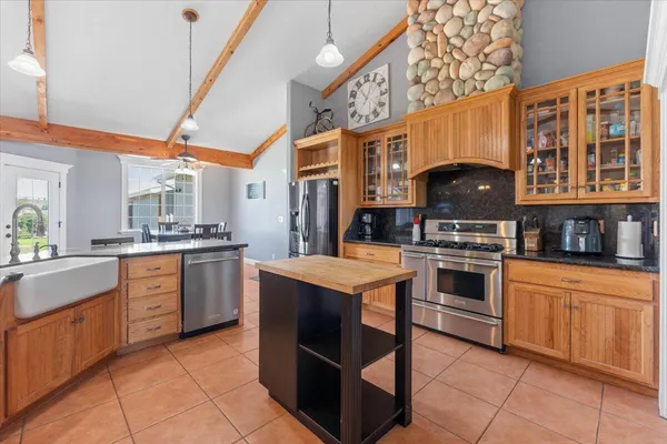 a bathroom with a sink vanity and a mirror