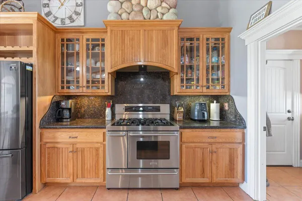 a view of a house with backyard porch and sitting area