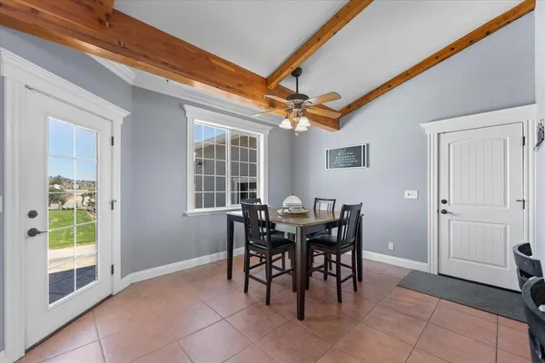 a view of a livingroom with furniture and a window