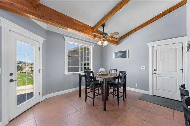 a view of a livingroom with furniture and a window