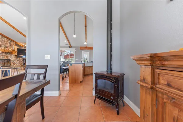 a view of a house with a swimming pool and a yard