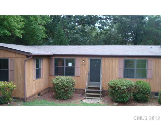 561 Bethlehem Road Statesville, NC 28677 - Photo 13 of 14 a backyard of a house with lots of green space