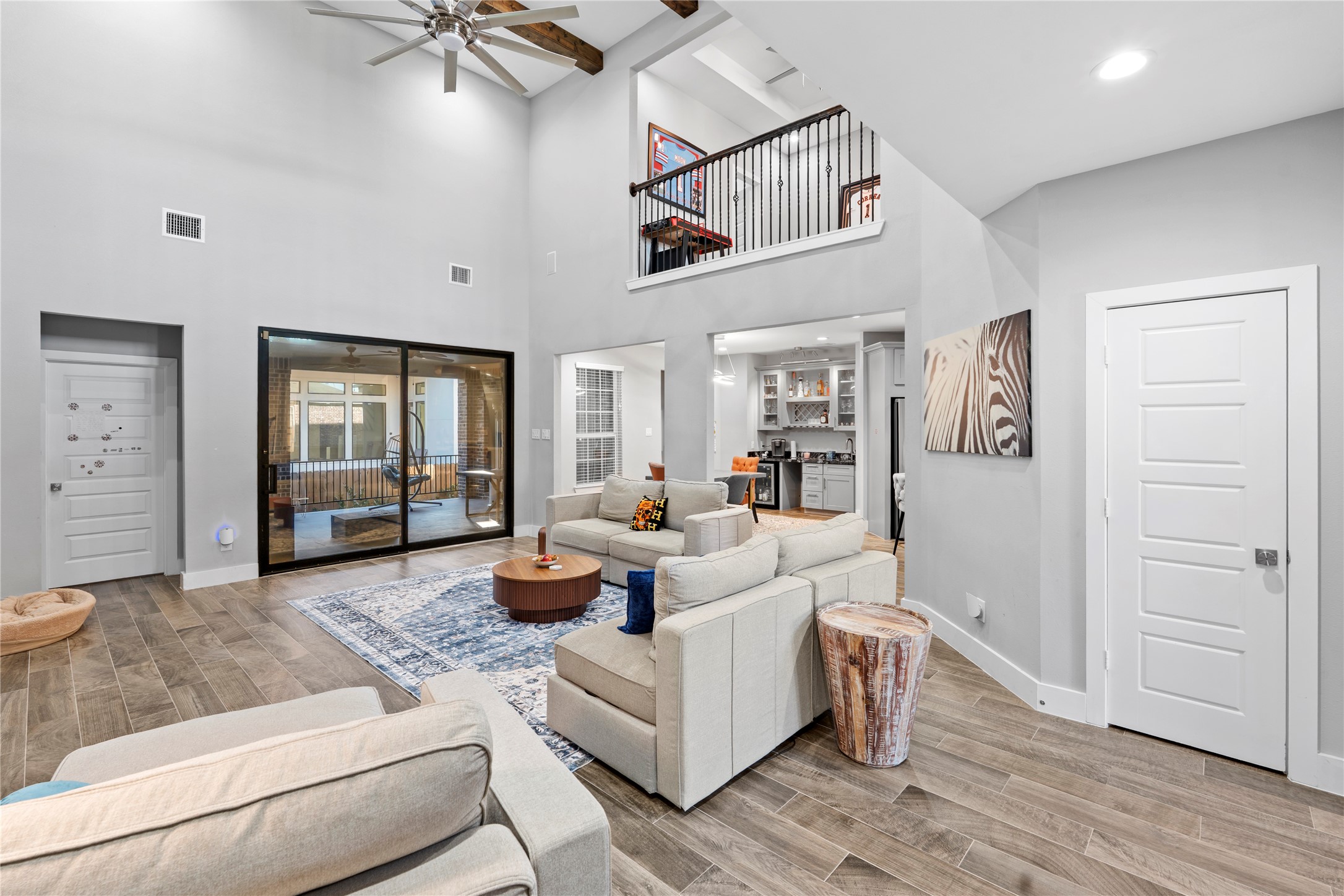 6207 Graff Net Court Spring, TX 77379 - Photo 6 of 49 Open living area with double glass sliders offering easy access to the outdoor patio.