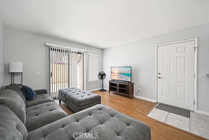 1339 Massachusetts Avenue, Unit 104 Riverside, CA 92507 - Photo 1 of 1 a living room with furniture and a window
