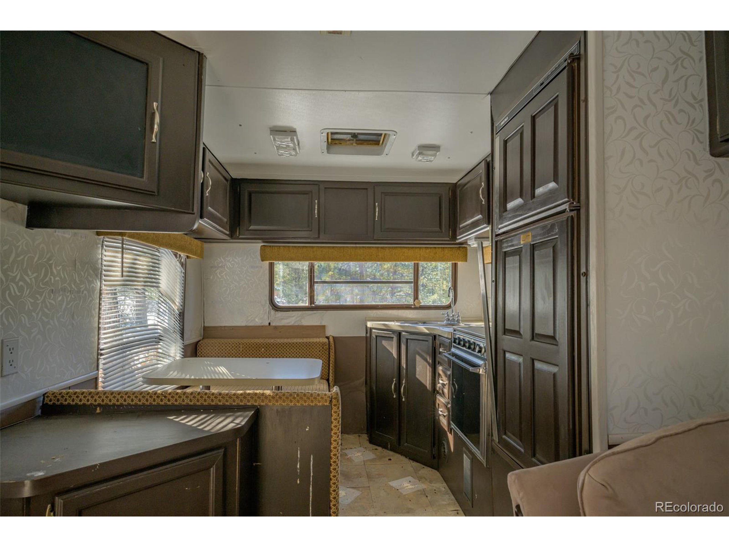 Escondido Road Weston, CO 81091 - Photo 16 of 48 a kitchen with stainless steel appliances granite countertop a refrigerator and a sink