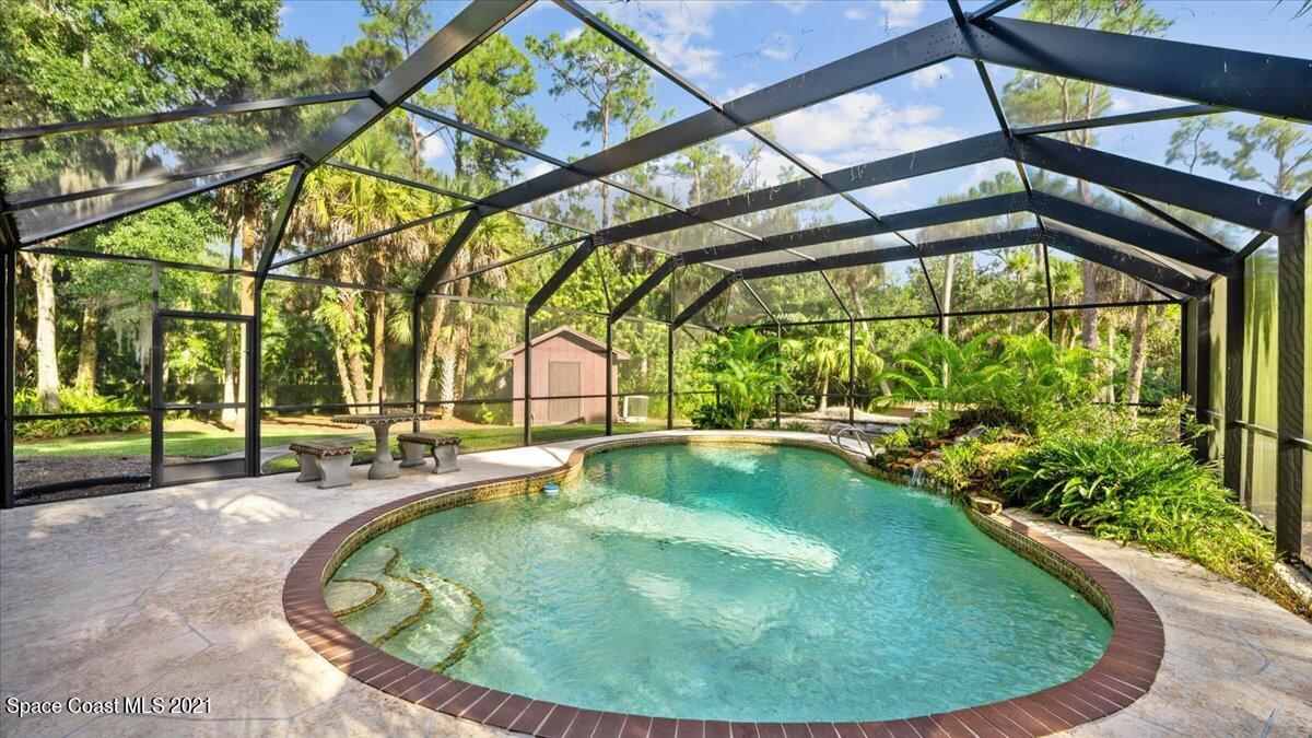 a view of a swimming pool with a patio
