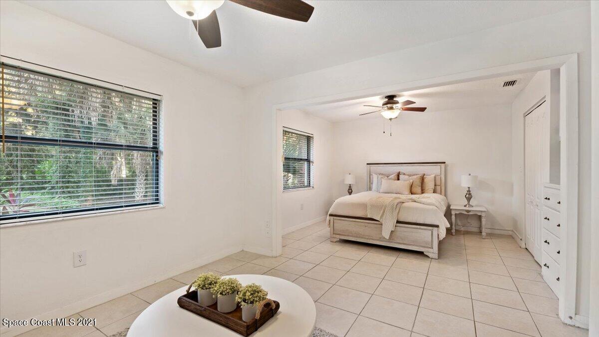 4455 Lake Washington Road Melbourne, FL 32934 - Photo 26 of 53 a bedroom with a bed and a window