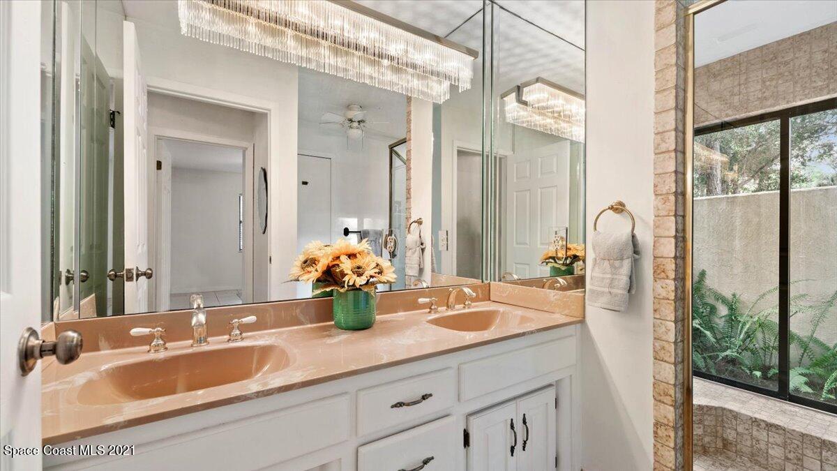4455 Lake Washington Road Melbourne, FL 32934 - Photo 28 of 53 a bathroom with a sink double vanity and mirror
