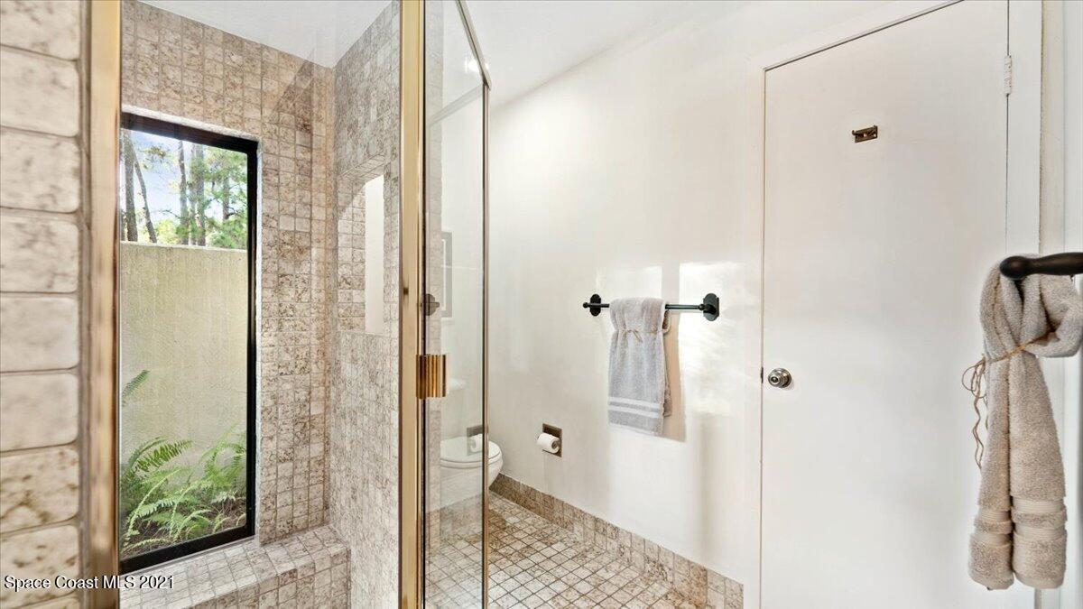 4455 Lake Washington Road Melbourne, FL 32934 - Photo 29 of 53 a bathroom with a shower