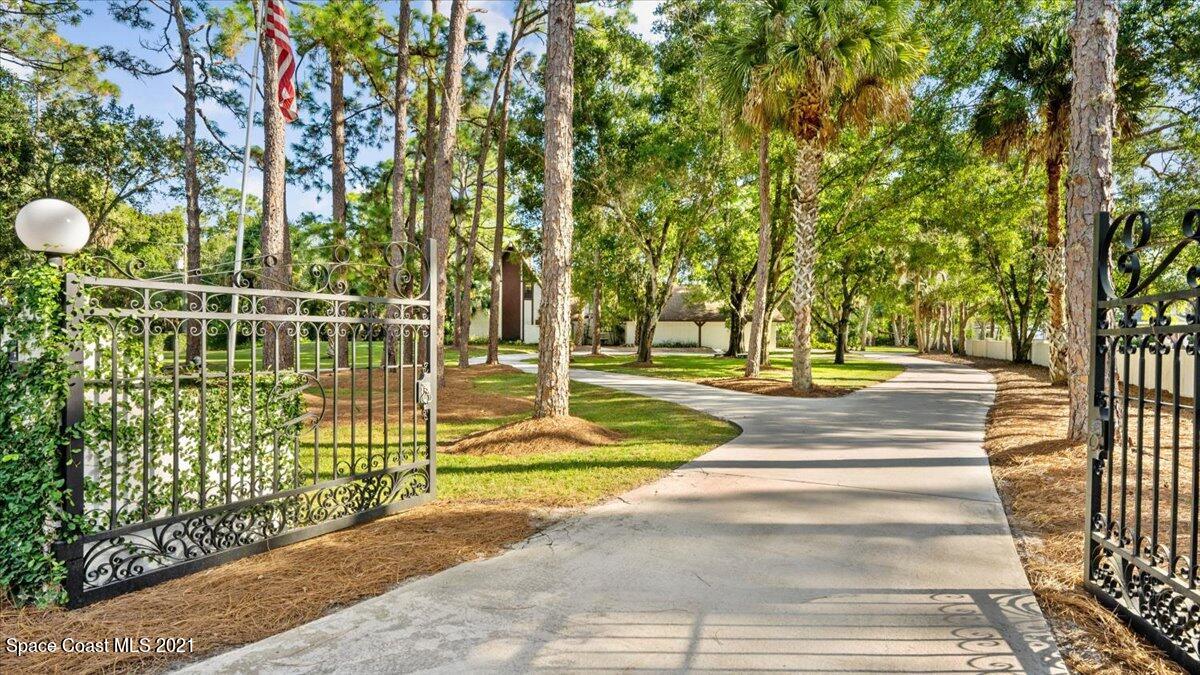 4455 Lake Washington Road Melbourne, FL 32934 - Photo 3 of 53 a view of a park with large trees