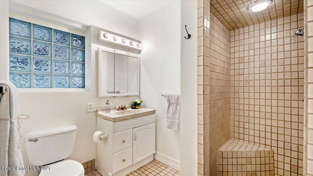 4455 Lake Washington Road Melbourne, FL 32934 - Photo 34 of 53 a bathroom with a sink toilet and shower