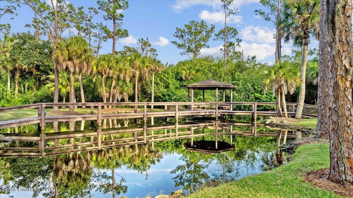 4455 Lake Washington Road Melbourne, FL 32934 - Photo 39 of 53 a view of swimming pool with outdoor seating and trees