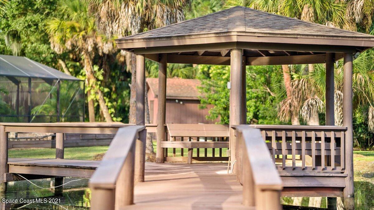 4455 Lake Washington Road Melbourne, FL 32934 - Photo 40 of 53 a view of an outdoor sitting area with a small yard