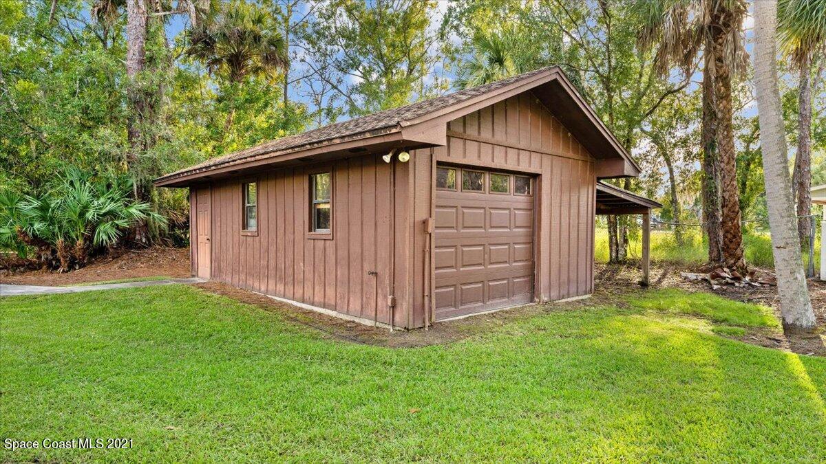 4455 Lake Washington Road Melbourne, FL 32934 - Photo 41 of 53 a view of a house with a yard and wooden fence