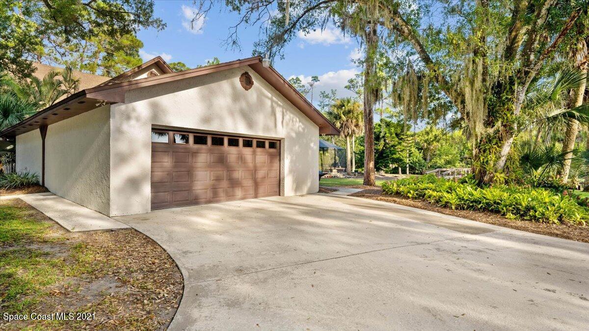 4455 Lake Washington Road Melbourne, FL 32934 - Photo 44 of 53 a view of backyard of a house