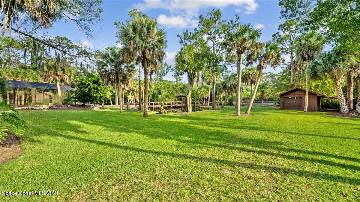 4455 Lake Washington Road Melbourne, FL 32934 - Photo 47 of 53 a view of a park with large trees