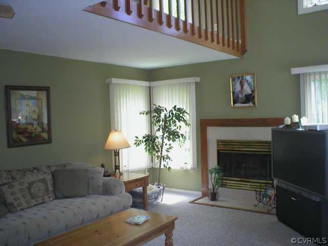 14324 Spring Gate Court Midlothian, VA 23112 - Photo 3 of 10 a living room with furniture and a fireplace