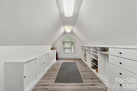 a view of a hallway with closet