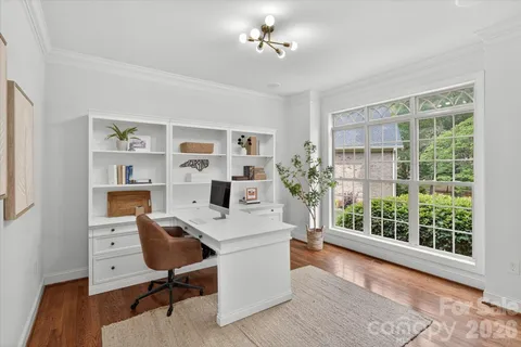 a workspace with furniture and window