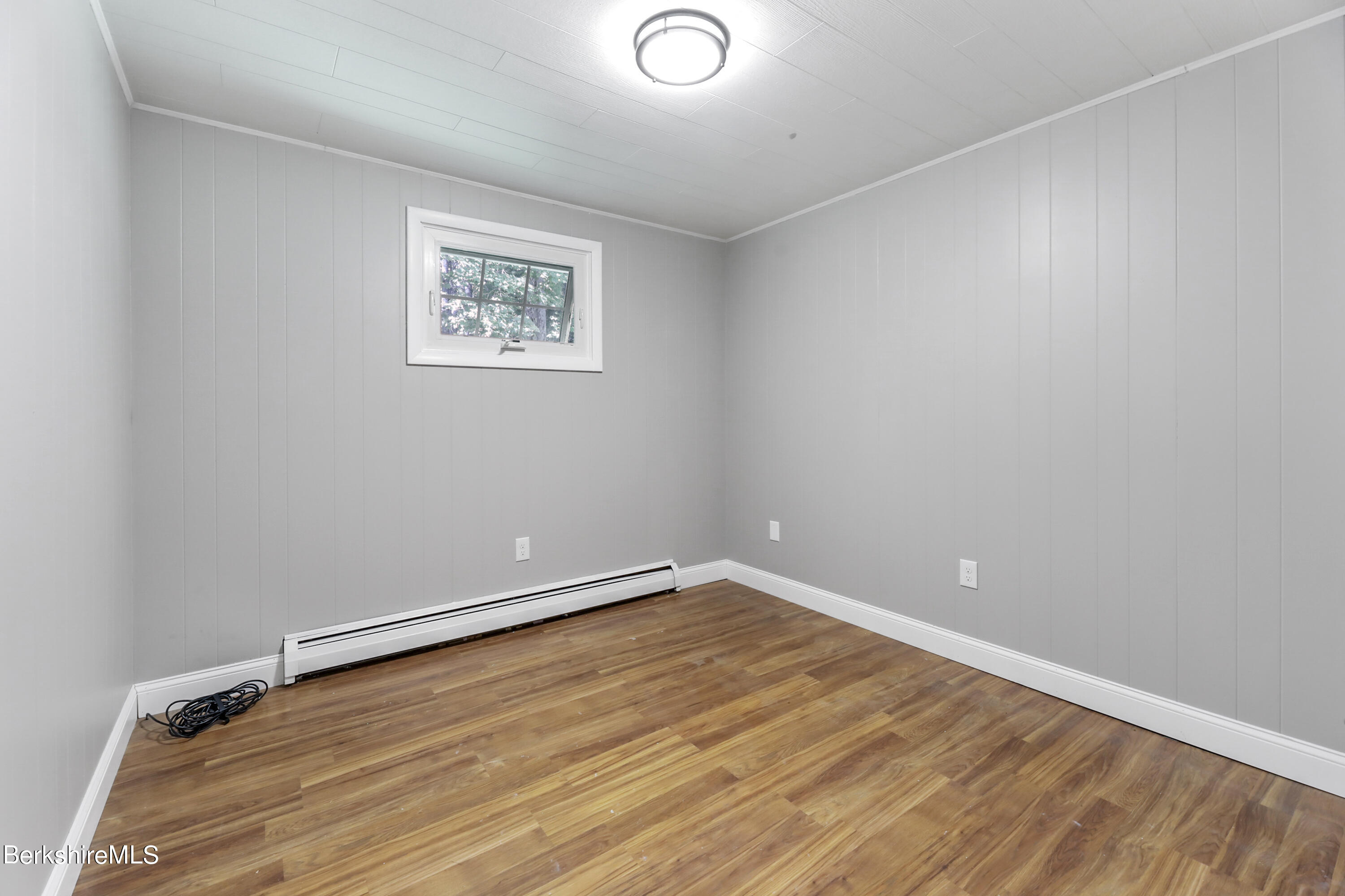 20 Hawley Road Savoy, MA 01256 - Photo 16 of 31 an empty room with wooden floor and windows