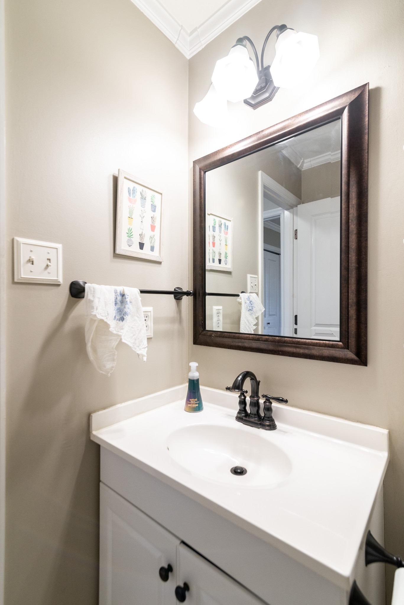 445 Parkside Circle Lebanon, TN 37087 - Photo 17 of 25 a bathroom with a sink and a mirror