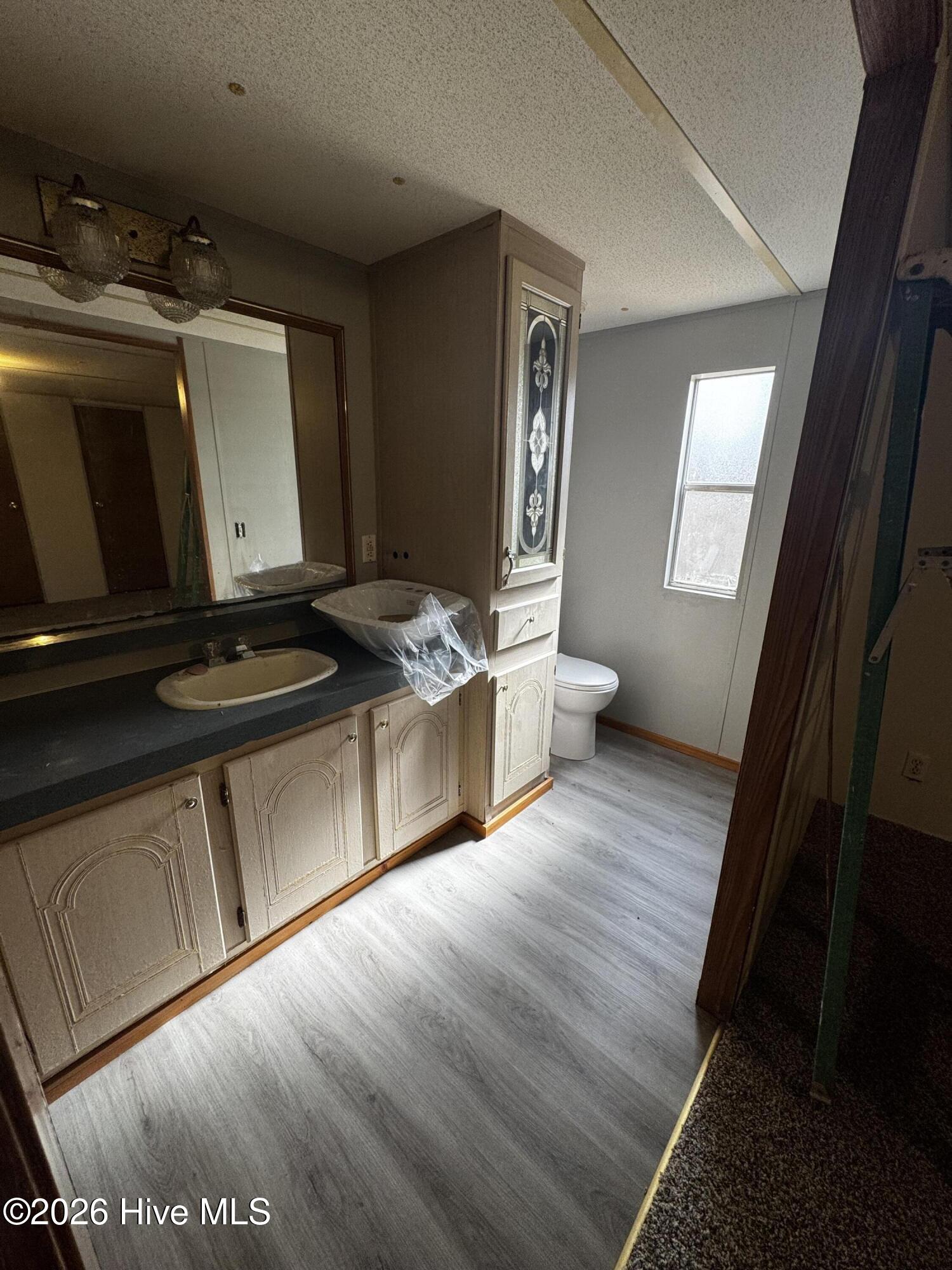 8103 Mackeys Road Roper, NC 27970 - Photo 9 of 24 Primary bath, new plank flooring and new sink to be installed
